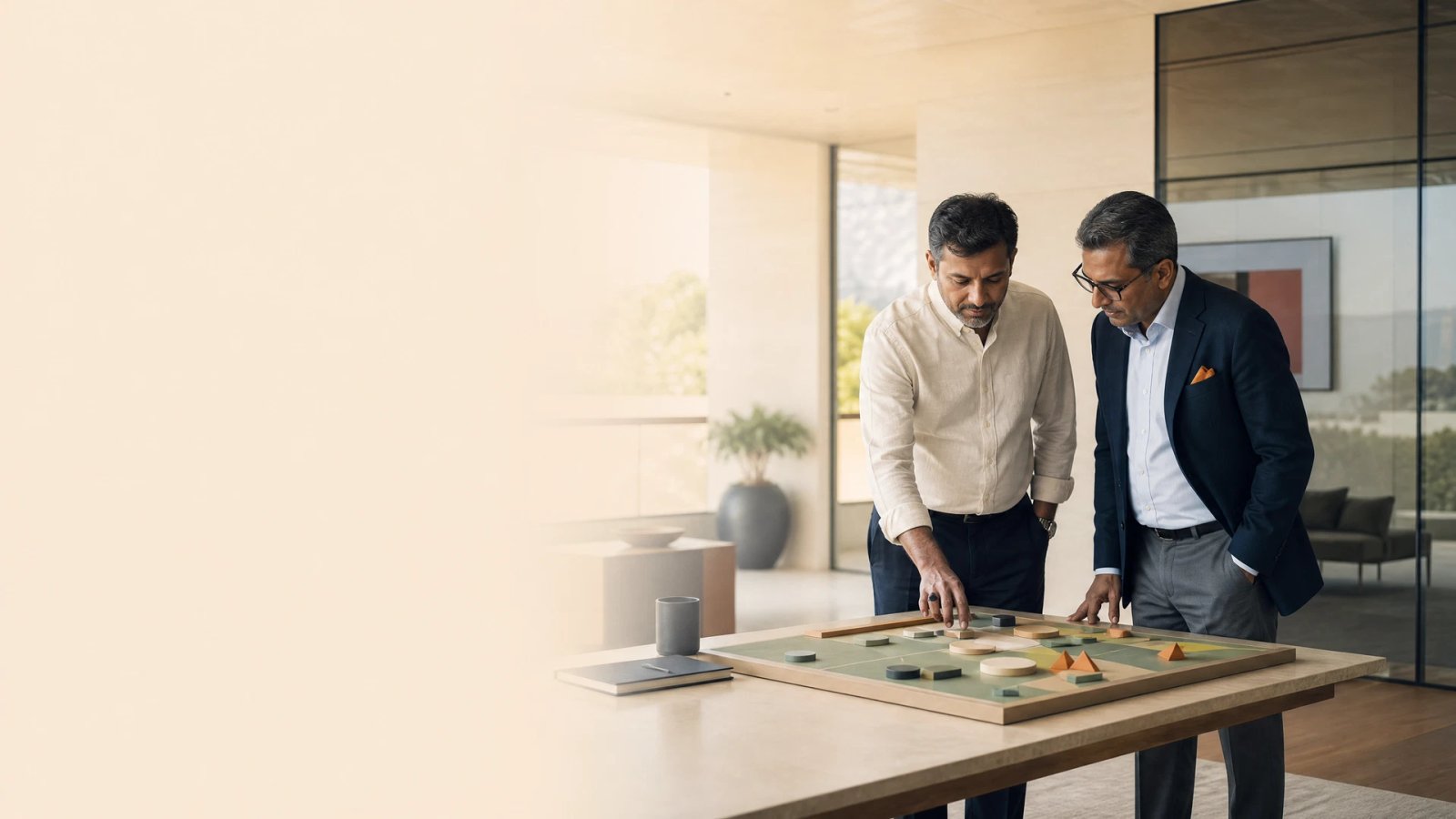Business owner and advisor reviewing priorities in a calm executive strategy room